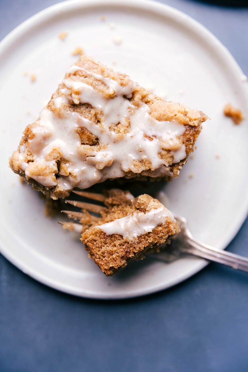 Overhead image of Apple Coffee Cake on a plate with a bite being taken out of it.