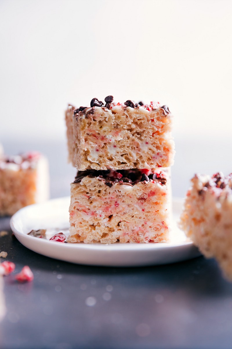 View of two Peppermint Rice Krispie Treats stacked on a plate.
